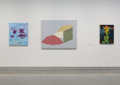 three paintings on a wall